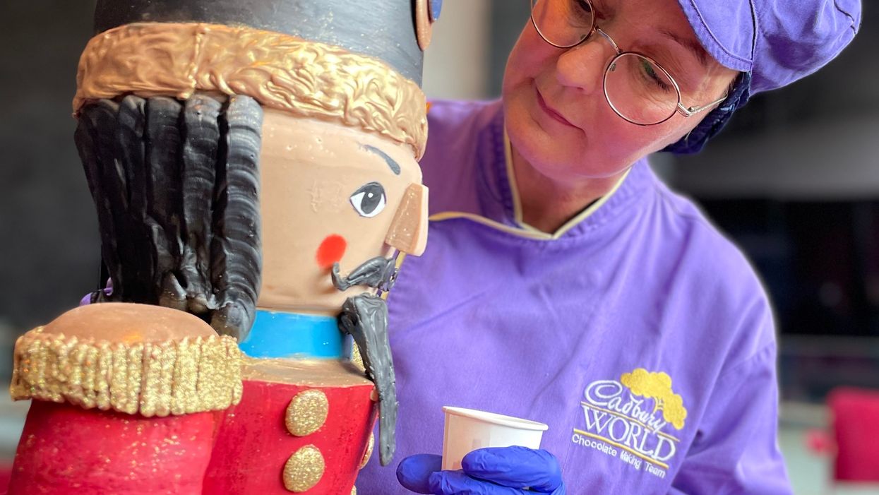 Cadbury World chocolatier Dawn Jenks adds some finishing touches to the chocolate Nutcracker model (Phil Barnett/PA)