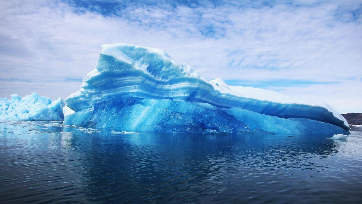 Calved icebergs from the nearby Twin Glaciers are seen floating on the sea off Qaqortoq, Greenland
