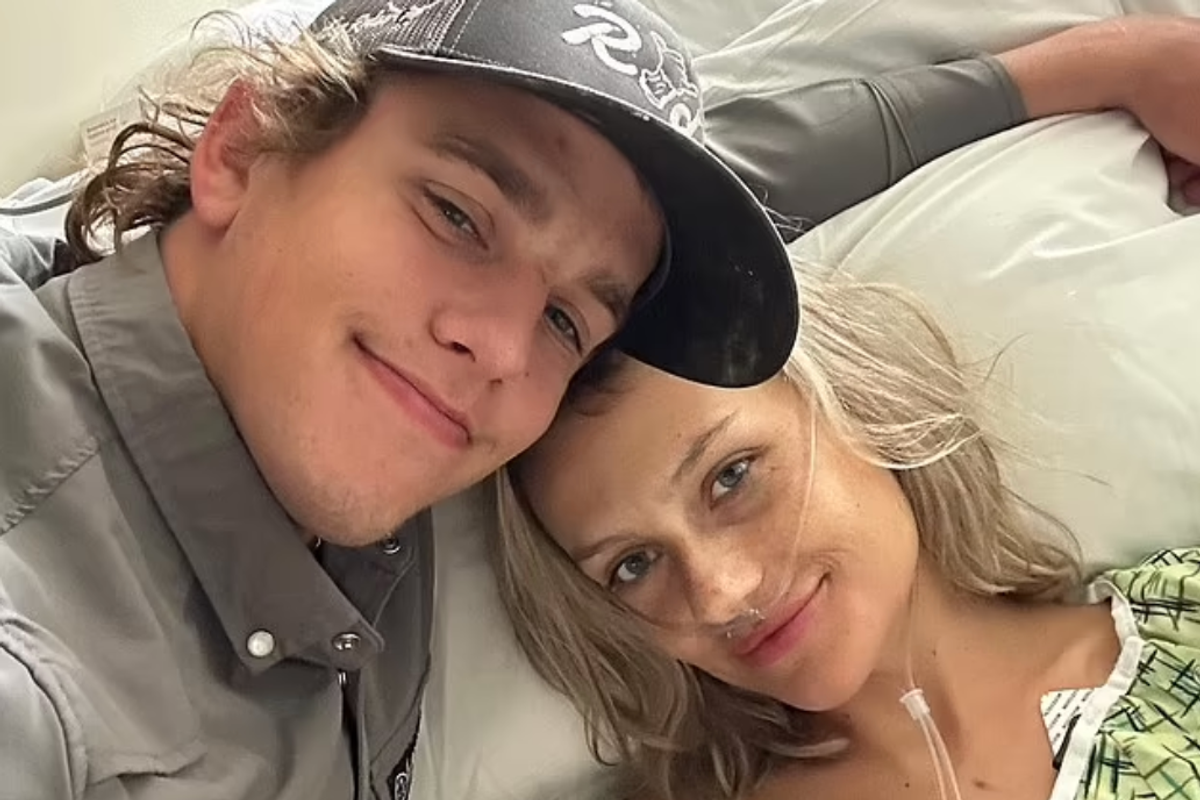 Cameron Grigg poses with Taylor Rousseau Grigg as she undergoes hospital treatment