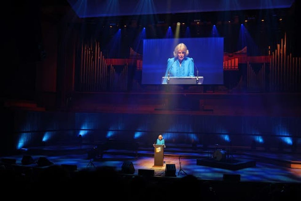 Camilla reads a letter as she takes part in a performance of Letters Live