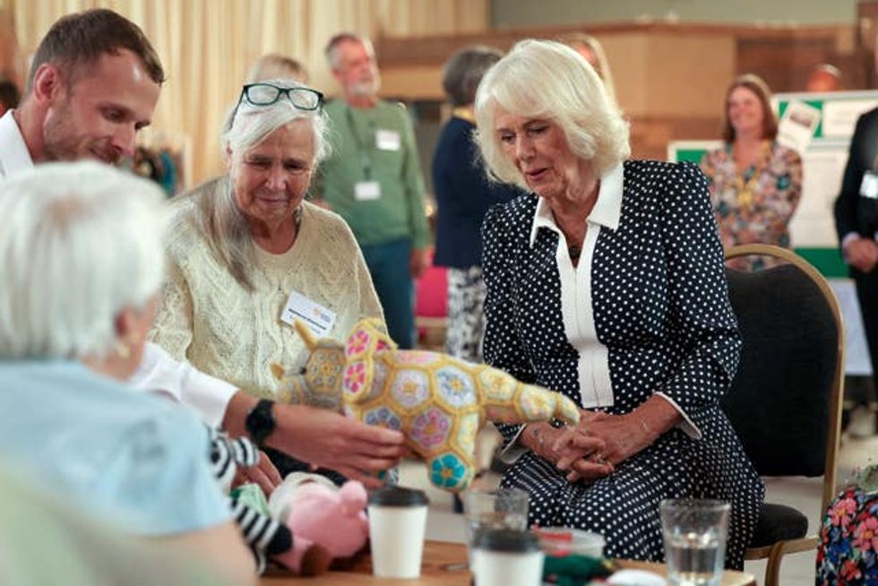 Camilla (right) meets members of a knitting club during her visit to Newquay