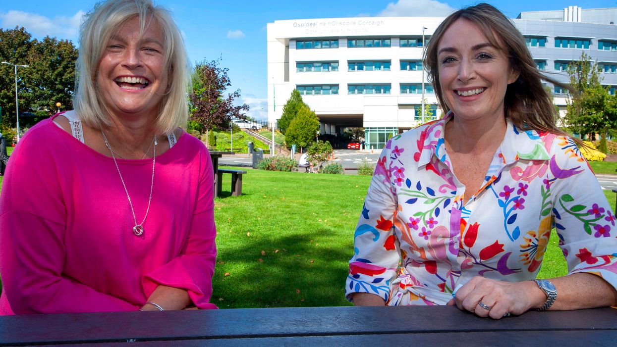 Cancer survivors and friends Sylvia McHenry, left, and Miriam Healy, who between then raised almost a tenth of the 550,000 euros needed to secure the Ion Torrent Sequencer for Cork University Hospital, through Cork Pink Week fundraising events. (Colm Lougheed/PA)