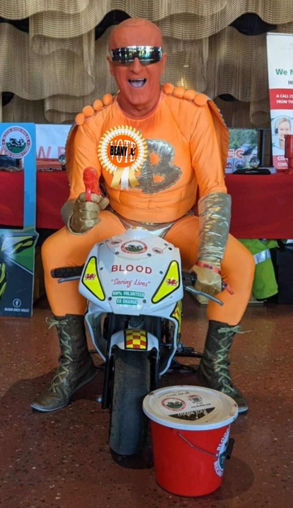 Captain Beany sitting on a small motorbike