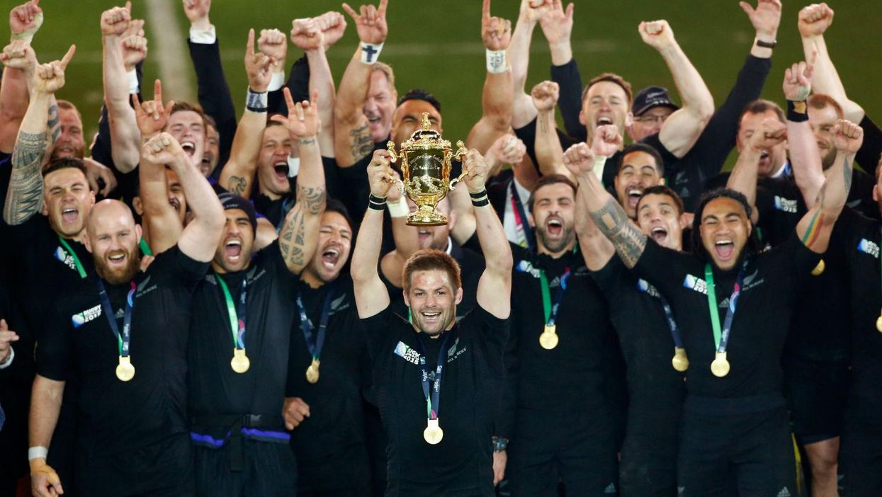 Captain Richie McCaw lifts the Webb Ellis Cup on Saturday