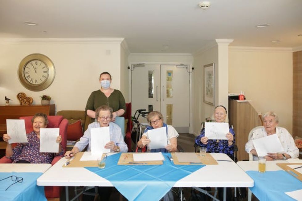 Care home residents enjoy a nude life drawing class