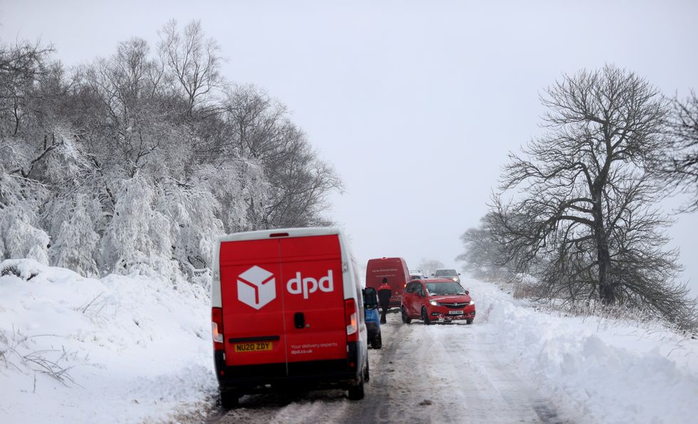Cars are stuck in snow that fell overnight from Storm Arwen, in Leek