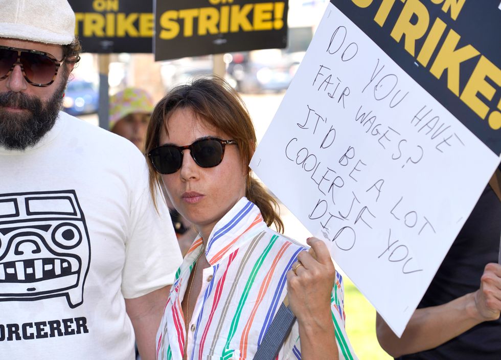 Cast of Parks And Recreation reunite on US picket line with four legged friend