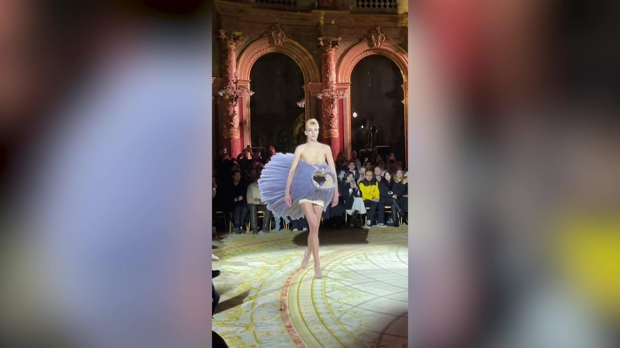Bizarre Paris Fashion Week show sees models carrying dresses instead of wearing them
