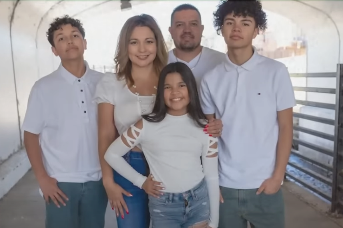 Celina and Joseph Quinones pose for a photo alongside their three children