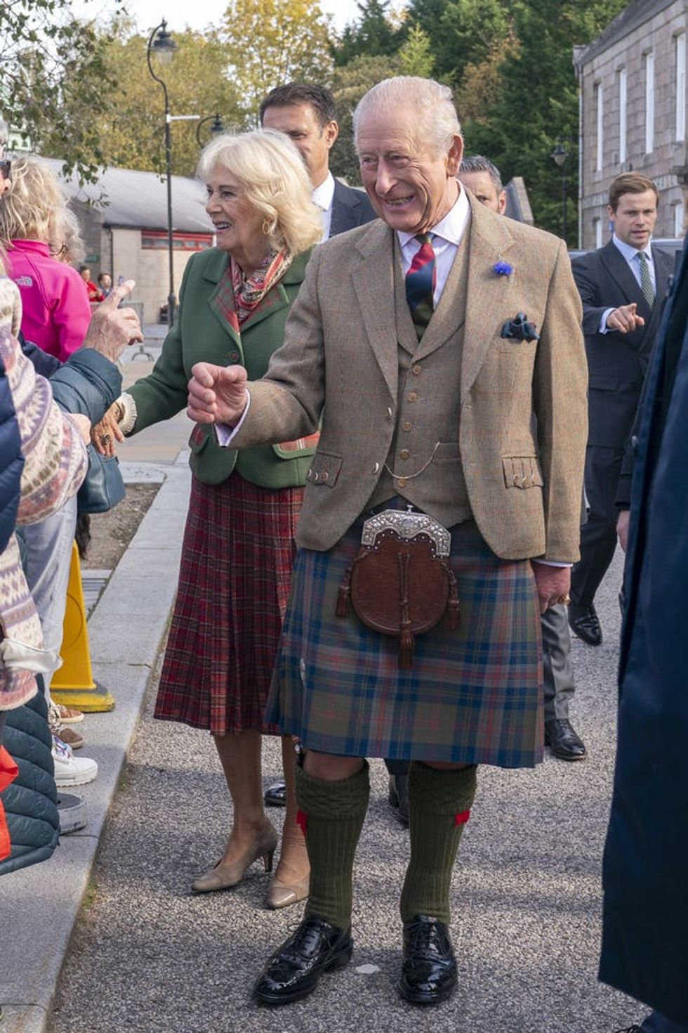 Charles and Camilla meet tourists outside the Albert Hall in Ballater