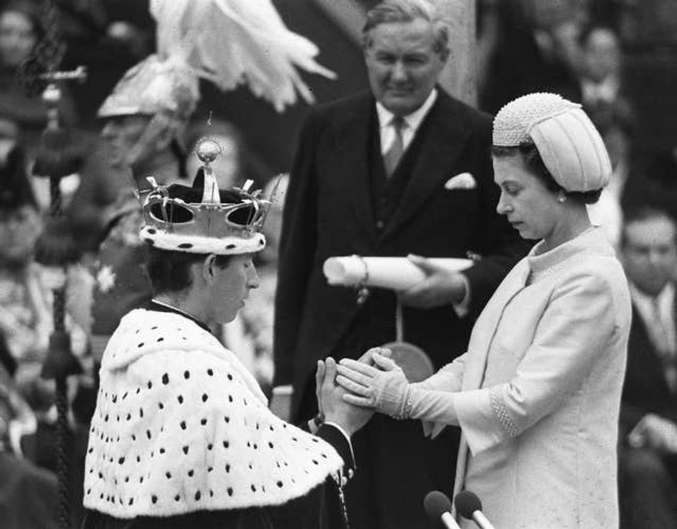 Charles being invested as the Prince of Wales at Caernarfon Castle by his mother Queen Elizabeth II in 1969 (