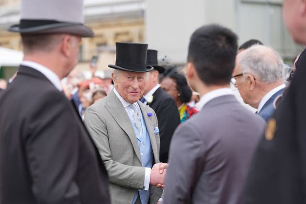 Charles greets guests at the party
