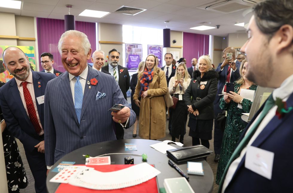 Charles laughs after the magician\u2019s mind trick (Chris Jackson/PA)