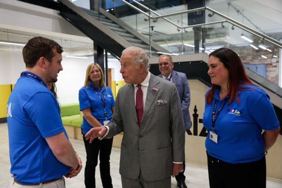 Charles meets members of staff during his visit to Horizon Youth Zone