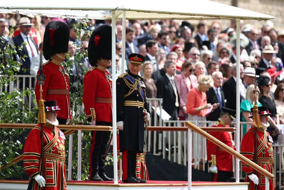 Charles takes his place on the dais during a ceremony at Windsor Castle