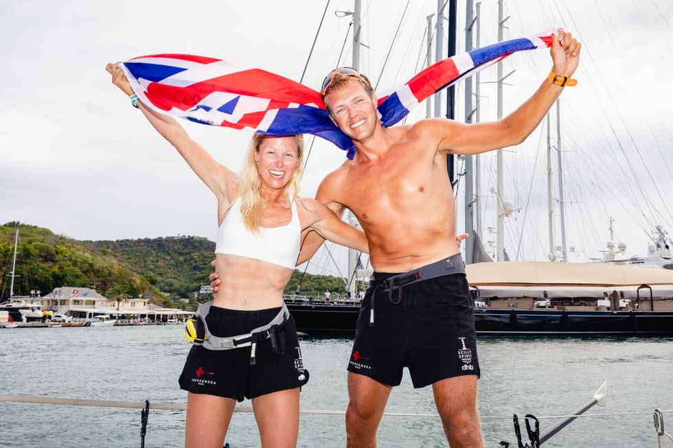 Charlie Fleury and Adam Baker celebrate after arriving in Antigua earlier this year (Atlantic Campaigns/PA)