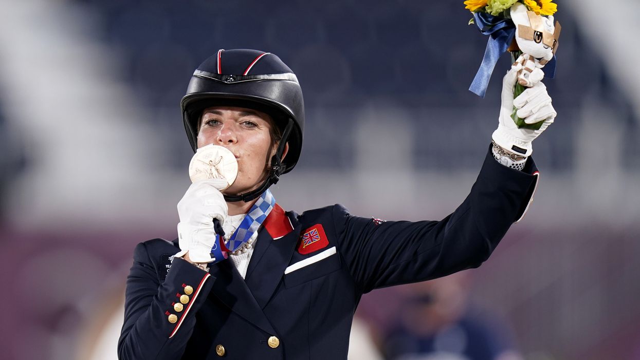 Charlotte Dujardin celebrates winning a bronze (Danny Lawson/PA)