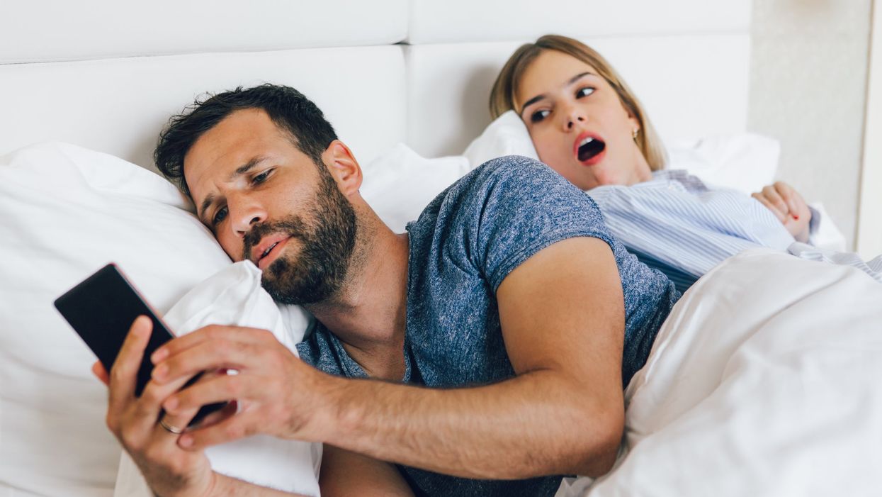 Cheating boyfriend in bed with his partner