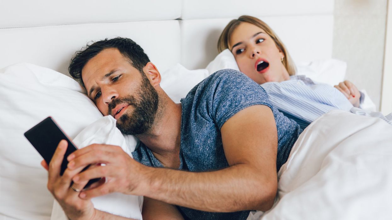 Cheating boyfriend in bed with his partner