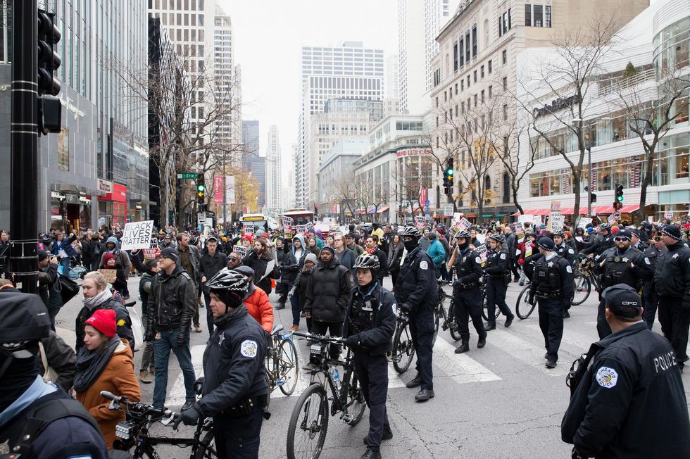 Chicago Police work to control about 400 anti-Black Friday protesters on Michigan Avenue on November 25, 2016 in Chicago, Illinois.