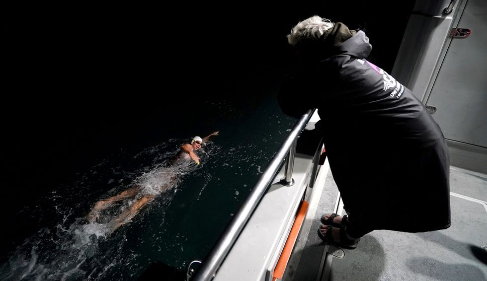 Chloe McCardel is watched by crew member Caroline Sims (Gareth Fuller/PA)