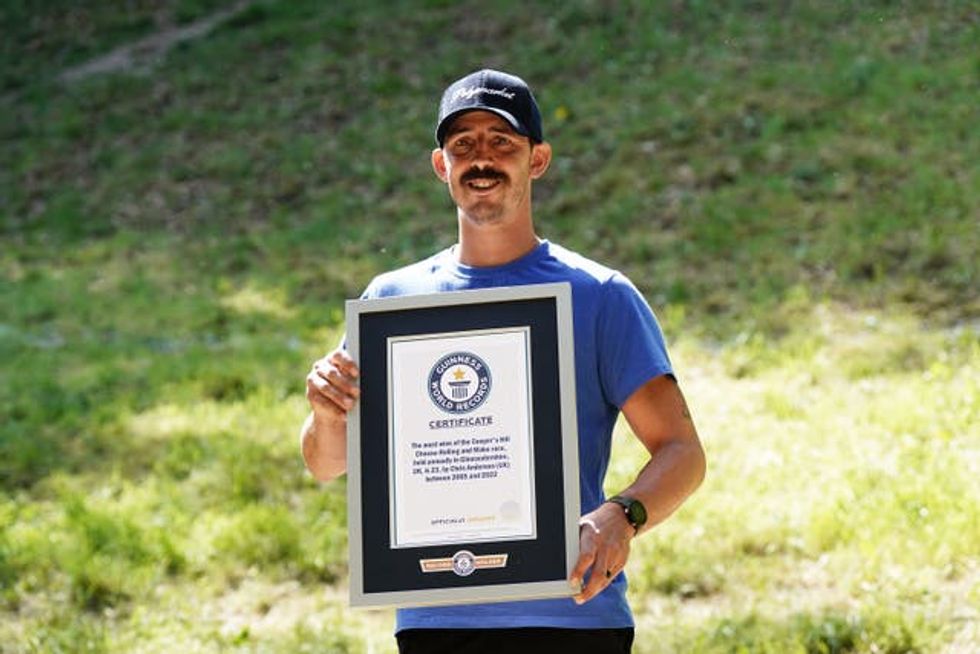 Chris Anderson with a Guinness World Records certificate f