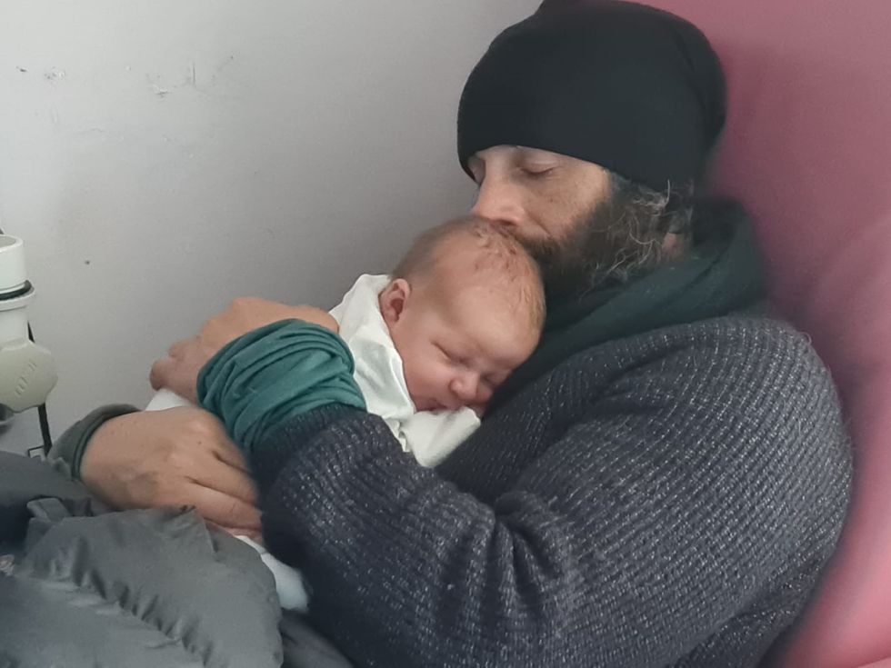 Chris Lewis and baby Magnus