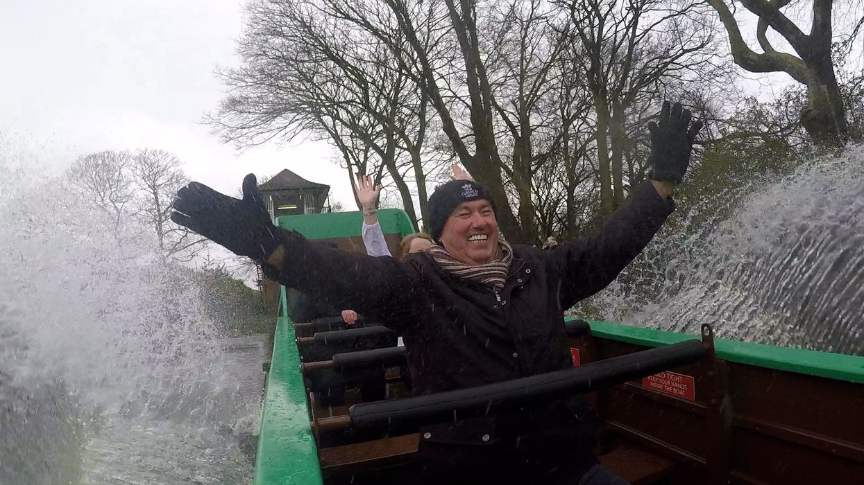 Cllr Dave Craker takes a ride on the listed Wicksteed splash boat in Hull’s East Park