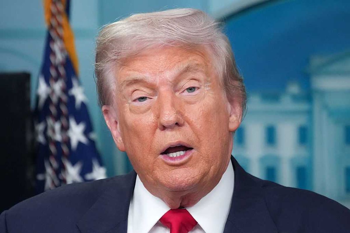 Close-up of Donald Trump speaking during a press briefing.