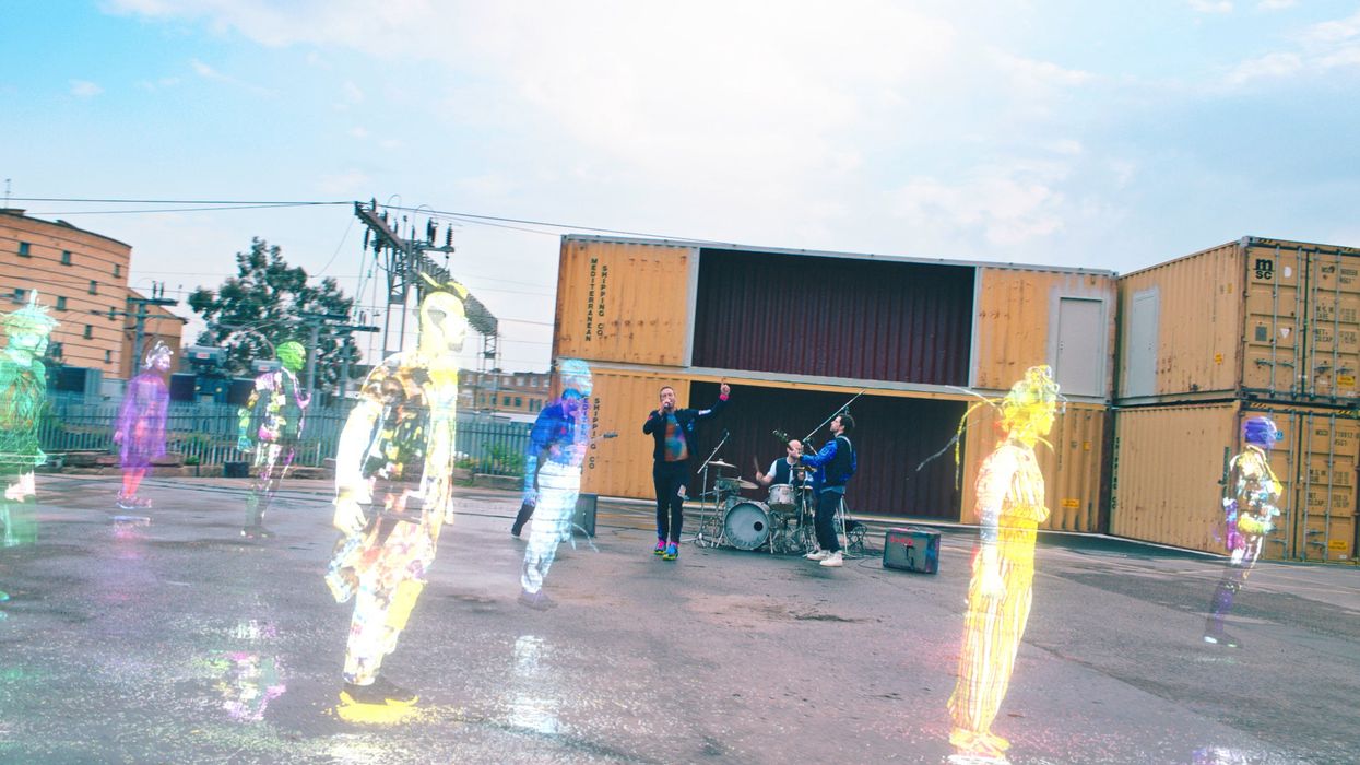 Coldplay perform among holograms