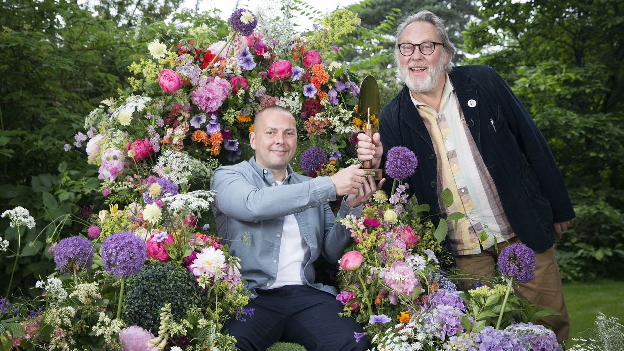 Comedian Vic Reeves (right) presents Gary McLaughlan with the Golden Trowel