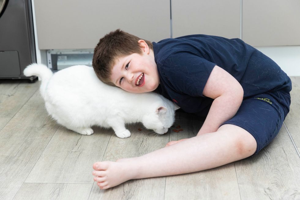 Connor Raven, age 6 and his cat Minty (Fabio De Paola/PA)