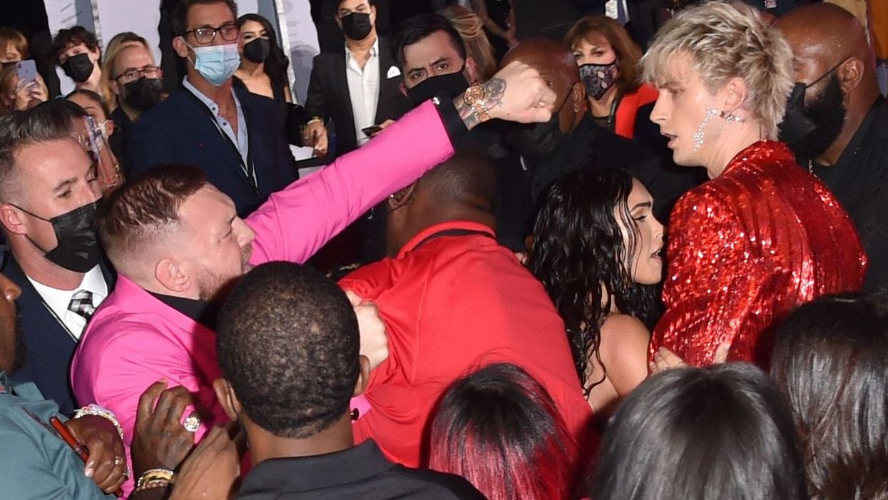 <p>Conor McGregor appears to throw a punch towards Machine Gun Kelly at the MTV Video Music Awards in New York</p>