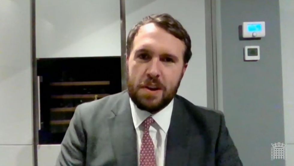 Conservative MP Jonathan Gullis after putting on a jacket