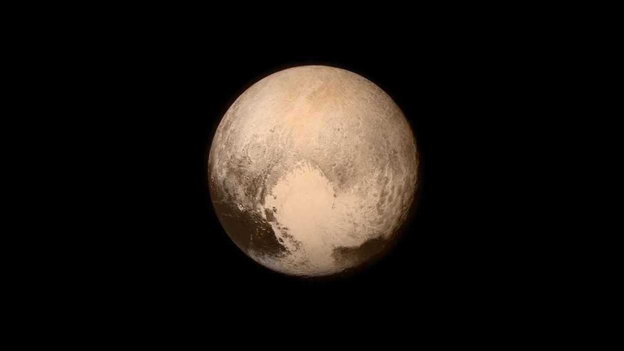 Surprise atmosphere on tiny icy world challenges astronomical theories