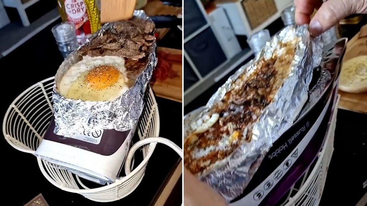 Couple cook steak on their iron so they don't have to move from watching TV