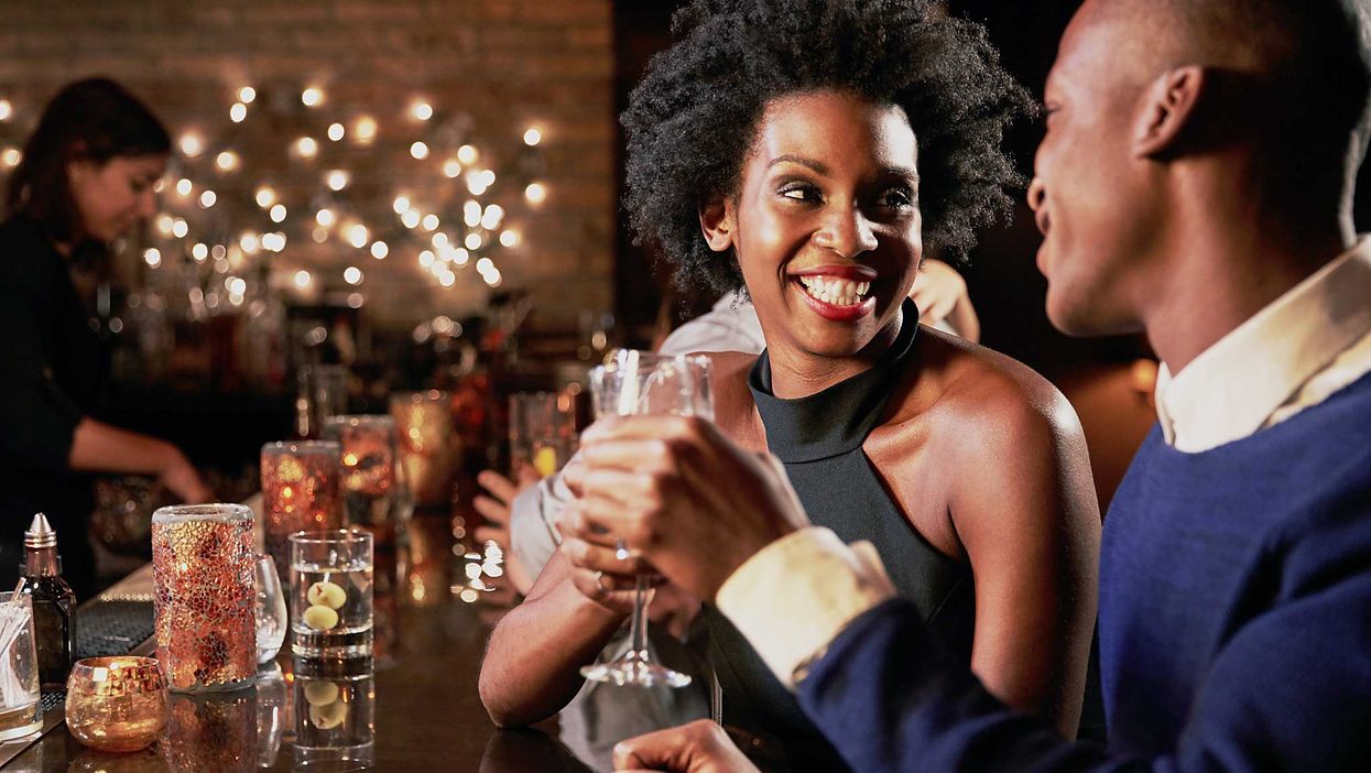 Couple Enjoying Night Out At Cocktail Bar