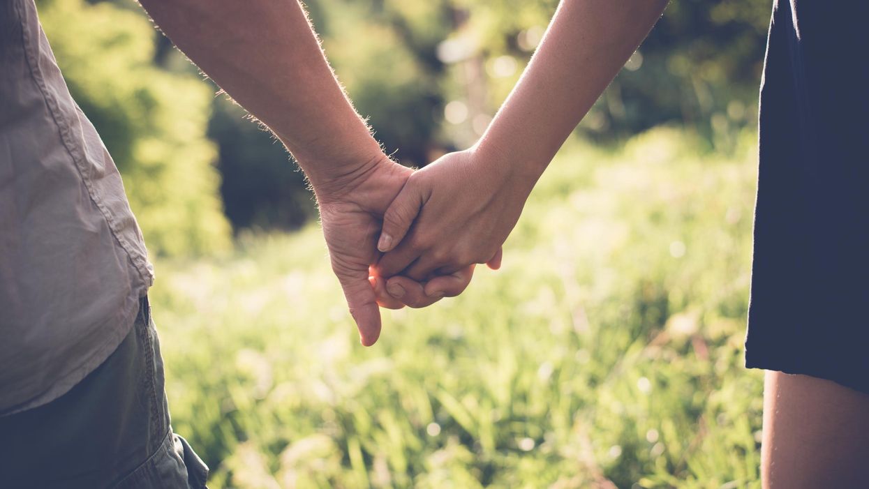 Couple holding hands
