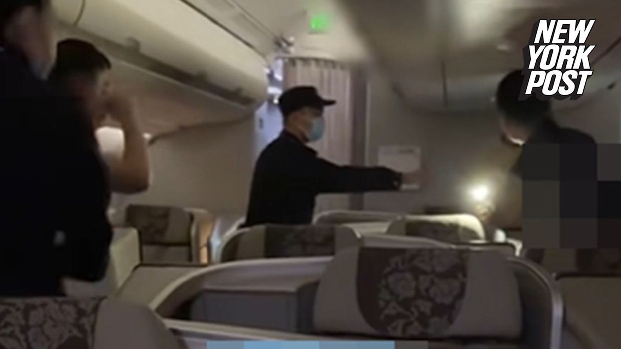 Man arrested for breaking out of plane and walking along wing is defended by fellow passengers