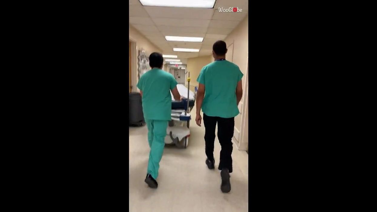 Cruel co-workers pull dead body prank on terrified morgue transporter