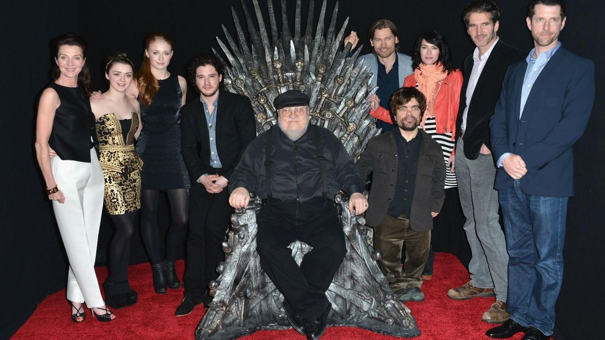 Creator of the fantasy novels series A Song of Ice and Fire George Martin sits on the Iron Throne from the set of Game of Thrones, the hit show based on his books