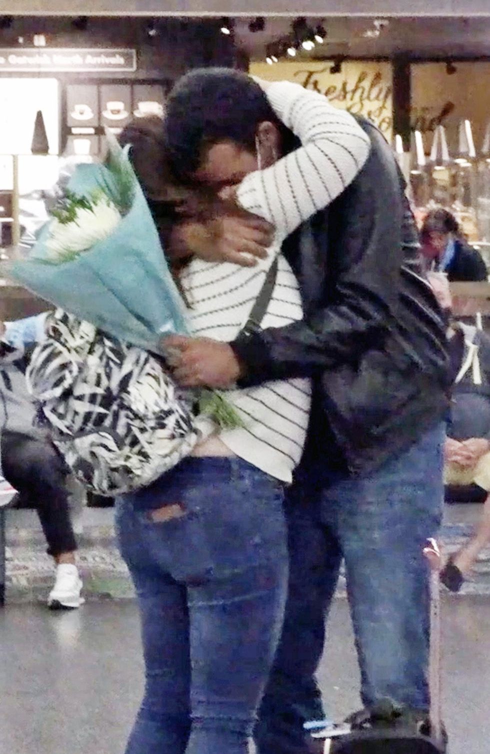 Cristina and Ben hug after being reunited (Karis Pearson/PA)