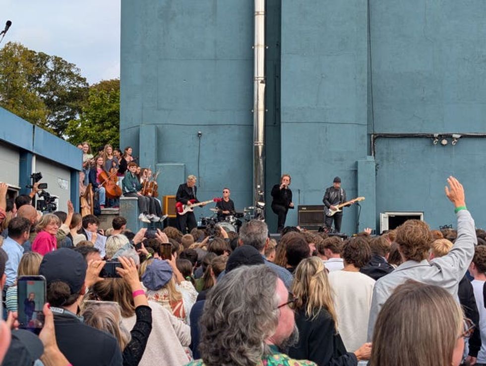 Crowds cheer as U2 perform