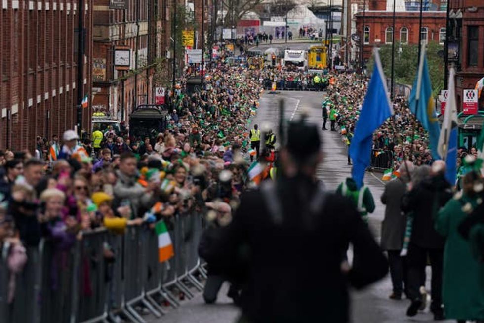 Crowds gather to watch performers take part in the St Patrick\u2019s Day Parade in Birmingham