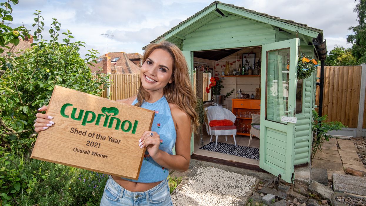 Cuprinol Shed of the Year winner Danielle Zarb-Cousin with her 70s-inspired cocktail bar (Cuprinol Shed of the Year/PA)