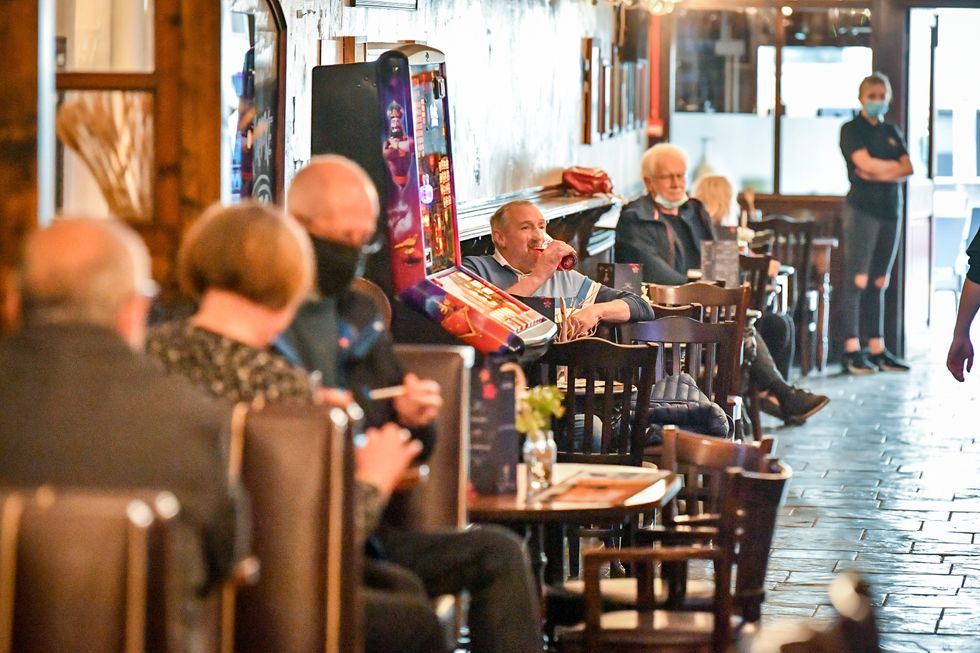 Customers inside The Borough pub on St Mary\u2019s Street, Cardiff (Ben Birchall/PA)