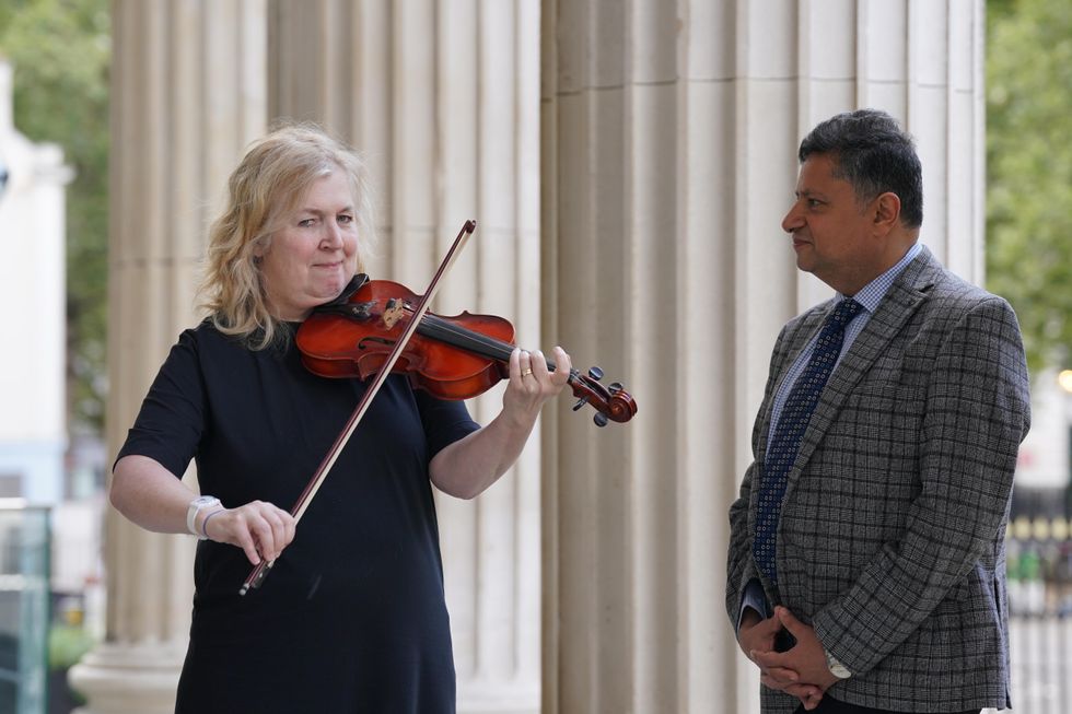 Woman who played violin during brain surgery reunites with doctor