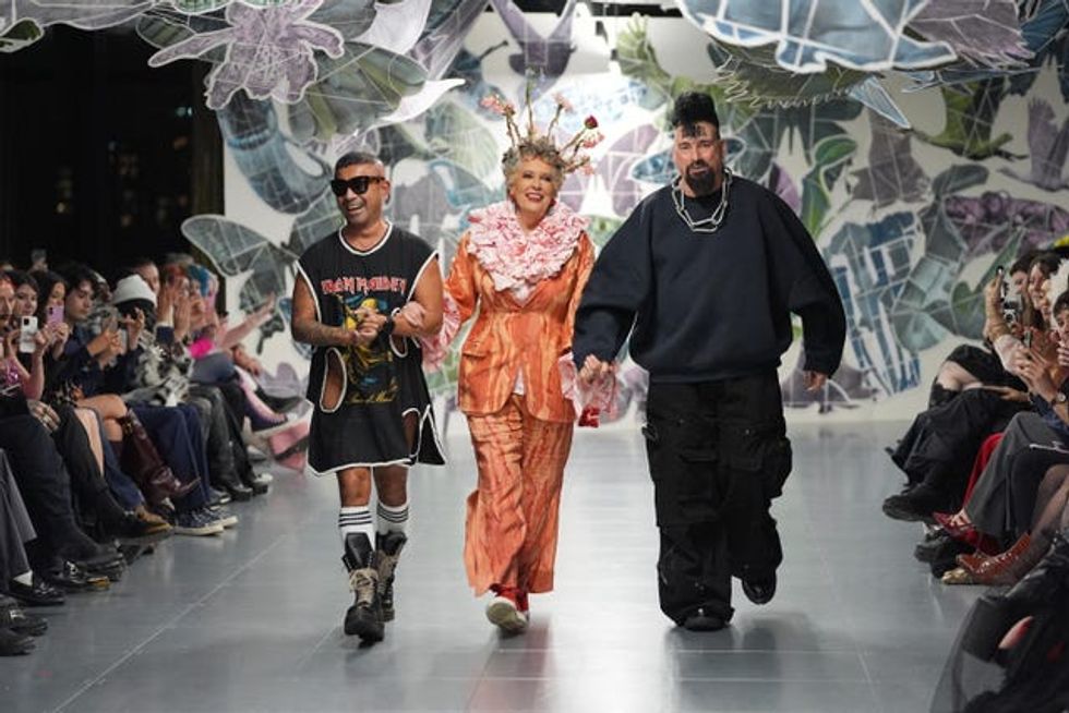 Dame Prue Leith with the designers on the catwalk at the Vin+Omi show at London Fashion Week