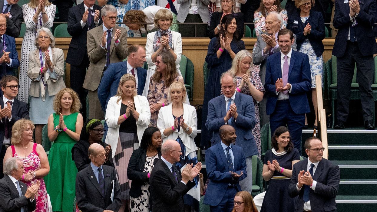 <p>Dame Sarah Gilbert pictured on the front row, wearing red and white</p>