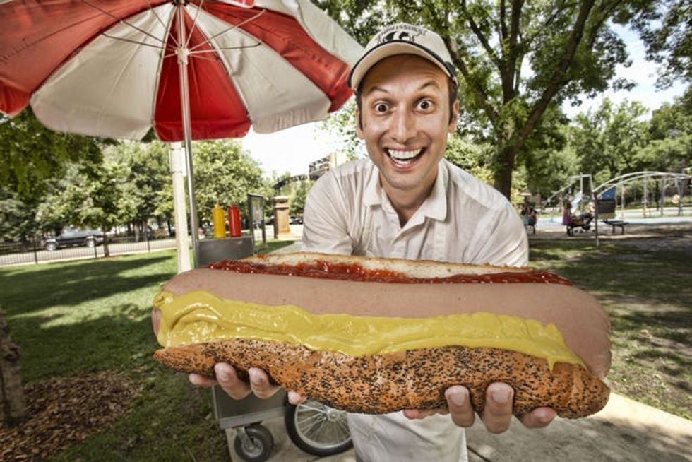 Dan Abbate holds the largest hot dog commercially available